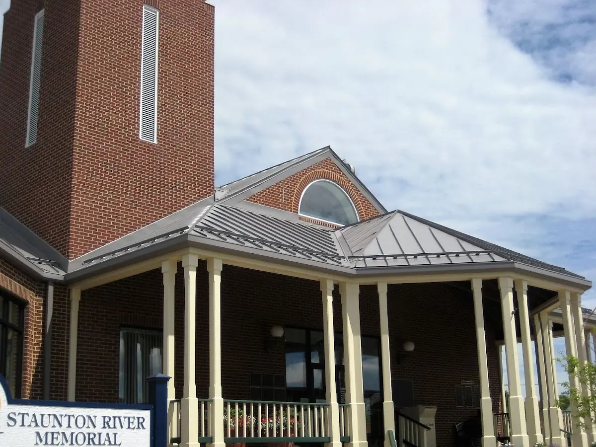 Skilled roofing craftsmen working on a residential roof in Dunn